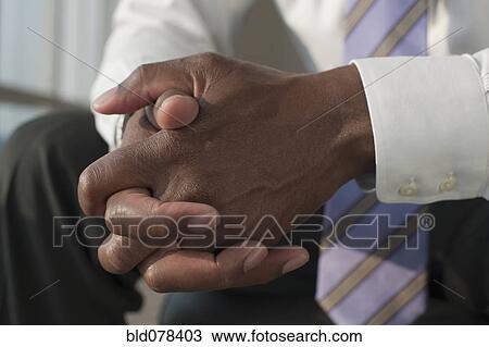 African American businessman with hands clasped View Large Photo Image Stock Image - African American businessman with hands clasped. Fotosearch