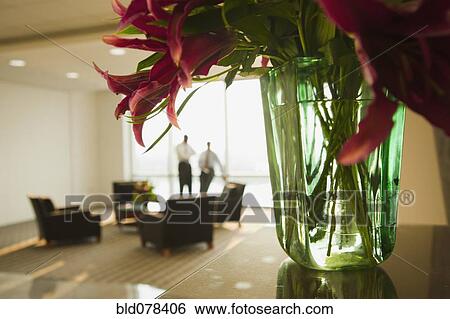 Businessmen having meeting in lobby View Large Photo Image Stock Photograph - Businessmen having meeting in lobby. Fotosearch