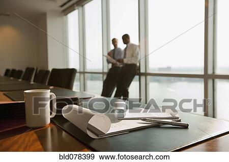 Stock Photo - Businessmen meeting in conference room. Fotosearch