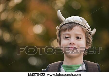 Mixed race boy in viking hat outdoors View Large Photo Image Stock Image - Mixed race boy in viking hat outdoors. Fotosearch