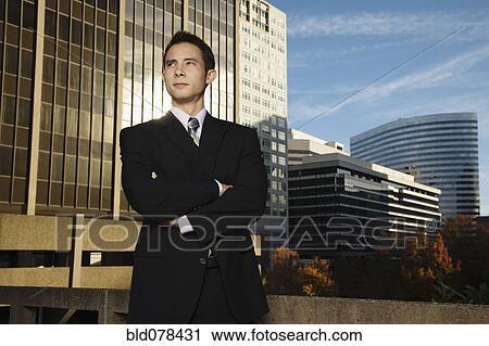 Mixed race businessman with arms crossed View Large Photo Image Stock Image - Mixed race businessman with arms crossed. Fotosearch