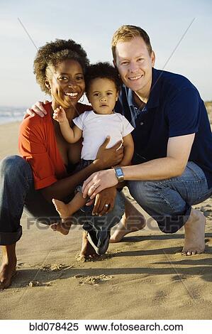 Multi-ethnic family enjoying beach View Large Photo Image Stock Photography - Multi-ethnic family enjoying beach. Fotosearch
