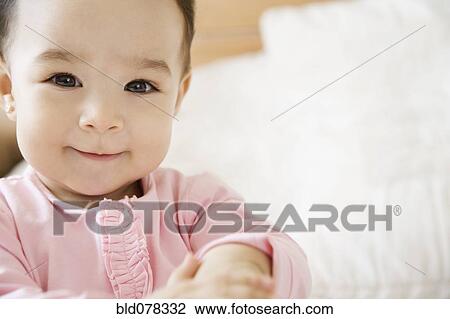 Smiling Hispanic baby girl View Large Photo Image Stock Image - Smiling Hispanic baby girl. Fotosearch