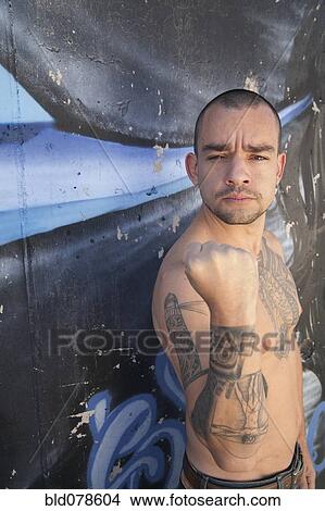 Bare chested Hispanic man with tattoos View Large Photo Image Picture - Bare chested Hispanic man with tattoos. Fotosearch