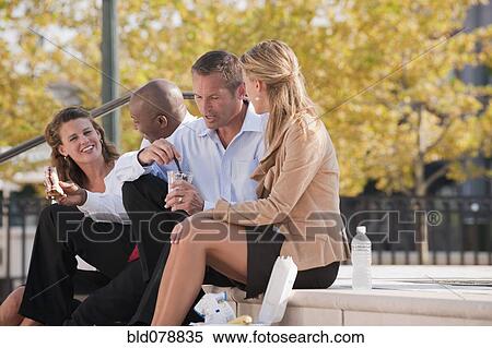 Business people eating lunch on steps View Large Photo Image Stock Photography - Business people eating lunch on steps. Fotosearch