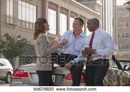 Stock Image - Business people talking together. Fotosearch