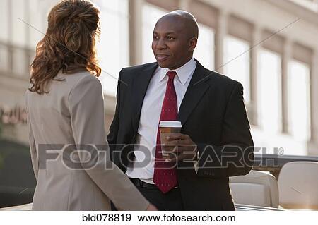Business people talking together View Large Photo Image Stock Photo - Business people talking together. Fotosearch