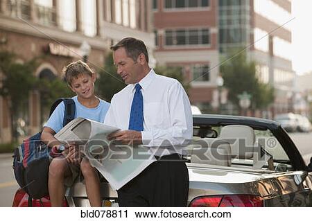 Caucasian businessman and son reading newspaper View Large Photo Image Stock Image - Caucasian businessman and son reading newspaper. Fotosearch