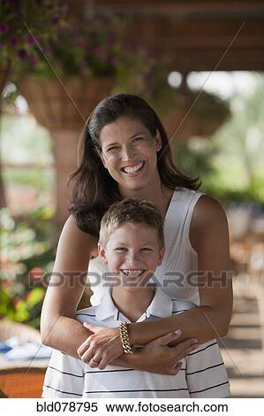 Caucasian mother hugging son View Large Photo Image Stock Photography - Caucasian mother hugging son. Fotosearch