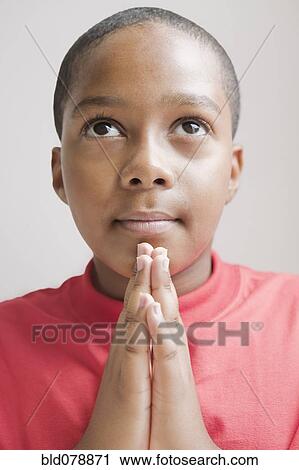 Hispanic boy praying View Large Photo Image Stock Image - Hispanic boy praying. Fotosearch