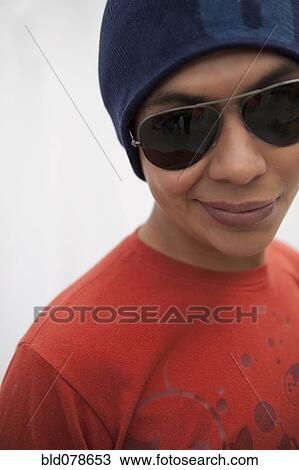 Hispanic man in cap and sunglasses View Large Photo Image Stock Image - Hispanic man in cap and sunglasses. Fotosearch