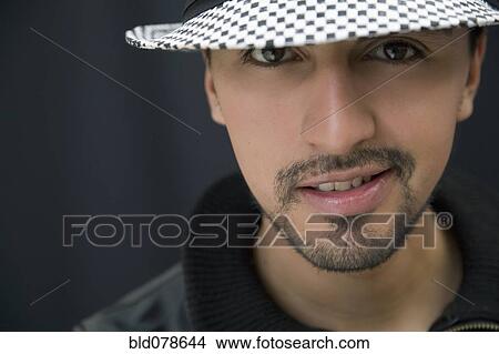 Hispanic man in hat and leather coat View Large Photo Image Picture - Hispanic man in hat and leather coat. Fotosearch