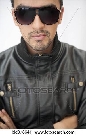 Hispanic man in sunglasses and leather coat View Large Photo Image Stock Image - Hispanic man in sunglasses and leather coat. Fotosearch
