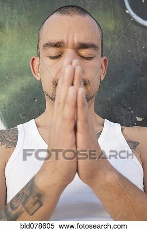 Hispanic man praying View Large Photo Image Stock Photography - Hispanic man praying. Fotosearch