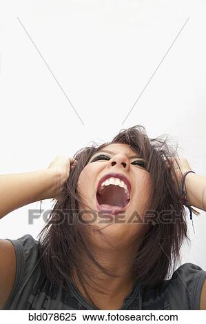 Stock Photography - Hispanic teenage girl shouting. Fotosearch