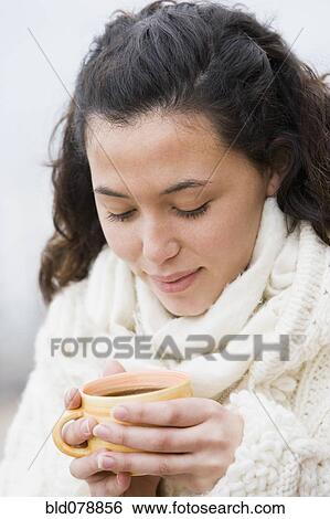 Hispanic woman drinking coffee View Large Photo Image Stock Photograph - Hispanic woman drinking coffee. Fotosearch