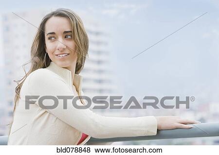 Hispanic woman standing outdoors View Large Photo Image Stock Photo - Hispanic woman standing outdoors. Fotosearch