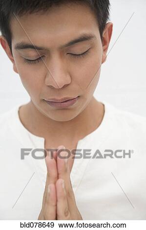 Praying Hispanic man View Large Photo Image Stock Photo - Praying Hispanic man. Fotosearch