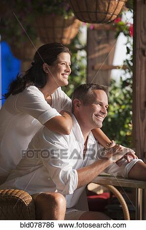 Smiling Caucasian couple in restaurant View Large Photo Image Stock Photograph - Smiling Caucasian couple in restaurant. Fotosearch