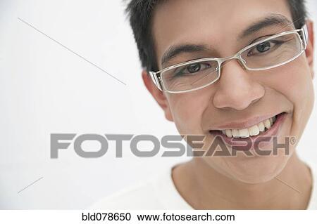 Stock Image - Smiling Hispanic man in eyeglasses. Fotosearch