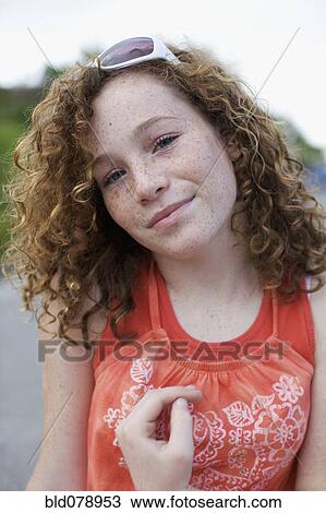 Stock Image - Caucasian girl wearing sunglasses. Fotosearch