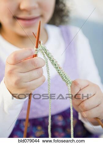 Hispanic girl knitting with yarn View Large Photo Image Picture - Hispanic girl knitting with yarn. Fotosearch