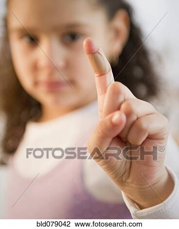 Hispanic girl with bandage on finger View Large Photo Image Stock Image - Hispanic girl with bandage on finger. Fotosearch