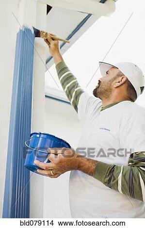 Latin man painting gutters View Large Photo Image Picture - Latin man painting gutters. Fotosearch
