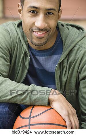 African American man holding basketball View Large Photo Image Picture - African American man holding basketball. Fotosearch
