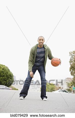 African American man playing basketball View Large Photo Image Stock Photo - African American man playing basketball. Fotosearch