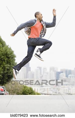 African American man running on urban street View Large Photo Image Stock Image - African American man running on urban street. Fotosearch