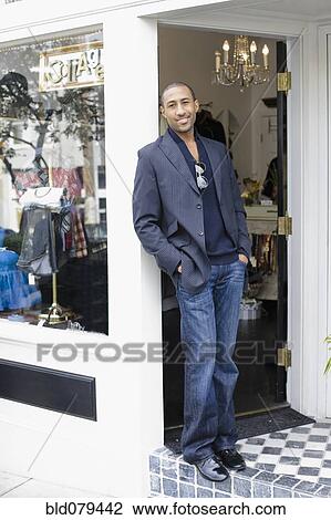 African American man standing in shop doorway View Large Photo Image Stock Image - African American man standing in shop doorway. Fotosearch
