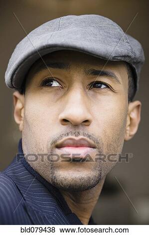 Stock Photo - African American man wearing cap. Fotosearch