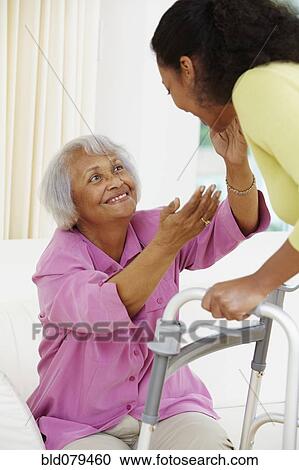 African American woman helping senior mother View Large Photo Image Stock Image - African American woman helping senior mother. Fotosearch