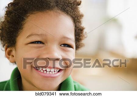 Stock Image - Black boy grinning. Fotosearch