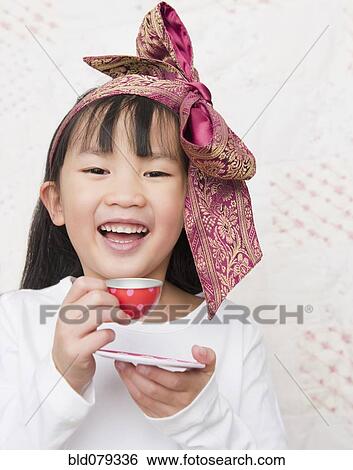 Stock Photograph - Chinese girl having tea party. Fotosearch