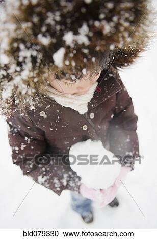 Chinese girl holding snowball View Large Photo Image Stock Image - Chinese girl holding snowball. Fotosearch