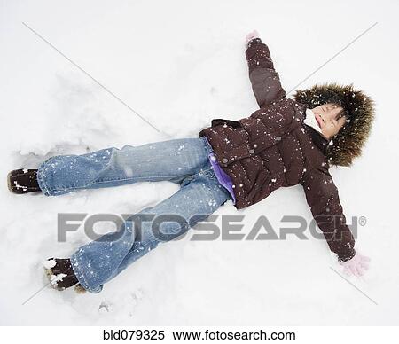 Chinese girl making snow angel View Large Photo Image Stock Photography - Chinese girl making snow angel. Fotosearch