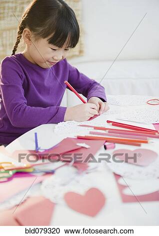 Chinese girl making Valentine's Day cards View Large Photo Image Stock Image - Chinese girl making Valentine's Day cards. Fotosearch