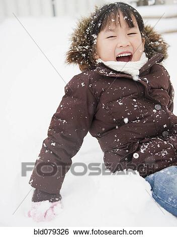 Chinese girl playing in snow View Large Photo Image Stock Photograph - Chinese girl playing in snow. Fotosearch