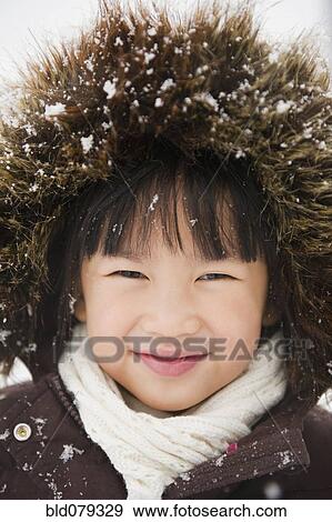 Chinese girl with snow-covered fur hood View Large Photo Image Stock Photo - Chinese girl with snow-covered fur hood. Fotosearch