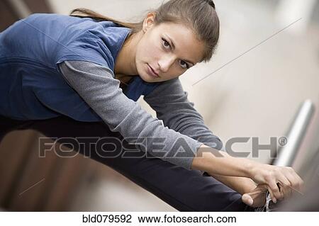 Hispanic woman stretching View Large Photo Image Stock Image - Hispanic woman stretching. Fotosearch