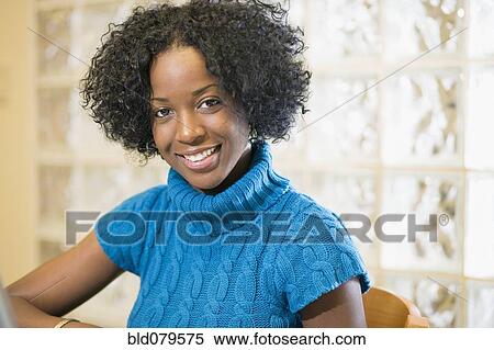 Stock Photography - Mixed race woman smiling. Fotosearch