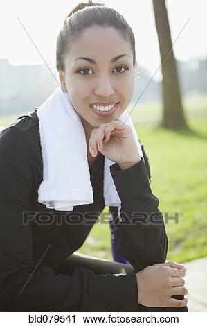 Mixed race woman with towel around her neck View Large Photo Image Stock Image - Mixed race woman with towel around her neck. Fotosearch
