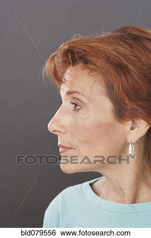 Stock Photograph - Profile of serious Caucasian woman. Fotosearch