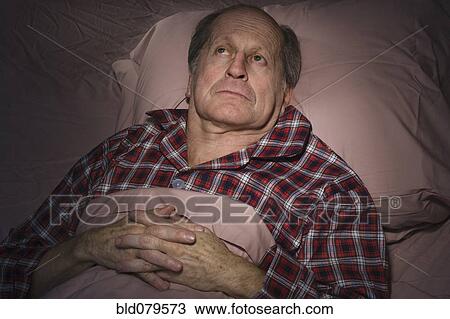 Senior Caucasian man having trouble sleeping View Large Photo Image Stock Image - Senior Caucasian man having trouble sleeping. Fotosearch