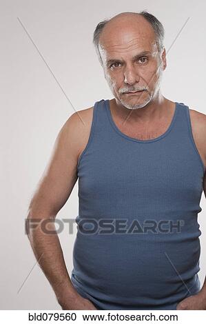 Serious Caucasian man in muscle-t View Large Photo Image Stock Image - Serious Caucasian man in muscle-t. Fotosearch