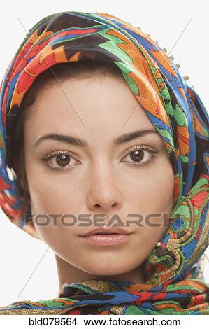 Picture - Serious Hispanic woman in elegant headdress. Fotosearch
