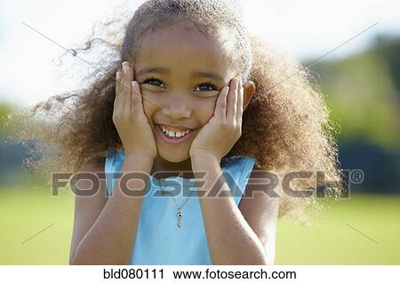 African American girl with hands on cheeks View Large Photo Image Stock Image - African American girl with hands on cheeks. Fotosearch