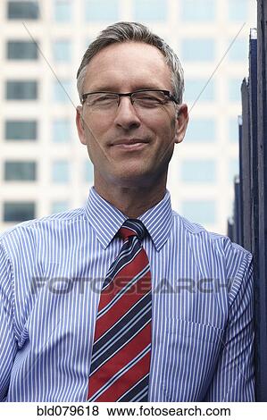 Stock Photo - Caucasian businessman smiling. Fotosearch